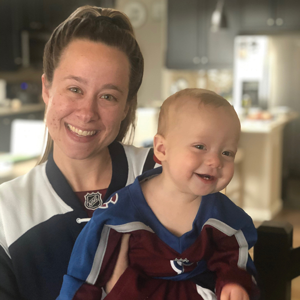 CORE employee, Michell Brigman, with her baby in an Avalanche jersey