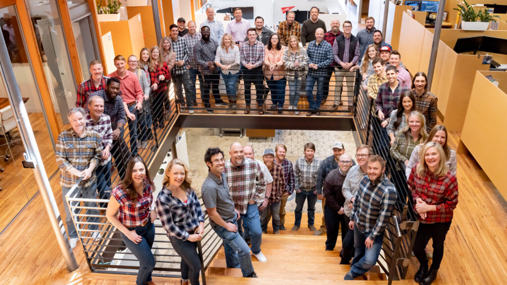 CORE employees posing in flannel